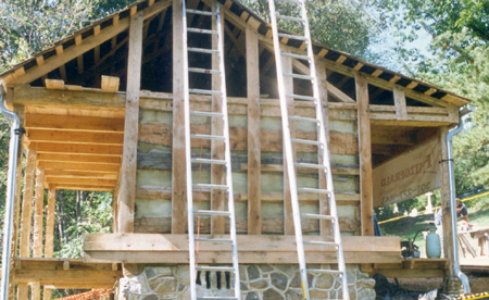 Logs and nailers exposed before clapboarding.
