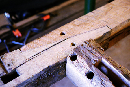 Timber frame splice detail in new joinery cut from salvaged and remilled timbers.   Note the credible period look of the salvaged material.