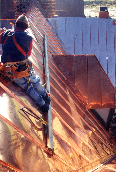 View of the copper roof project from above gables showing ridge and valley details.
