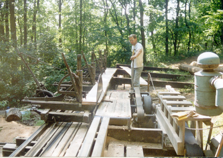 Squaring the edge of a short stack of boards.