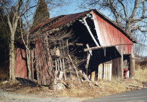 Kingsley Corncrib, before timber frame restoration. Side bays were corncribs, note open door at right. Project located in Gaithersburg, Maryland, in Montgomery County.