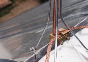 Lightning protection detail on the Dahlgren barn restoration project, showing grounding of new metal roof. Also shows treatment of ridge and standing seam terminations.