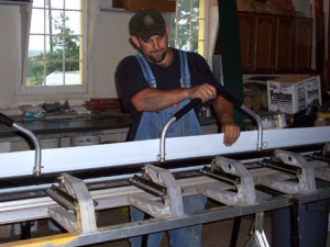 "Tin knocker" produces a termination drip flashing on the sheet metal brake.