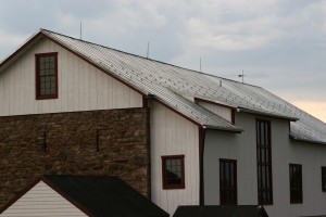 Finishing Touches -- Traditional Copper Lighting Suppression System Installed on Standing Seam Roof