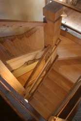 A Custom Box Winder Staircase Blends High-Finish Elemetns With Rough Heavy Timbers