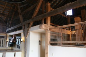 Rough Surfaces Flow Into Finished Spaces to Create an  Inviting Home 