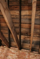 Reclaimed Rough-Sawn Boards Form Ceiling of Second Floor