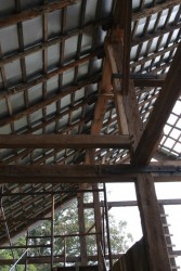 Supplemental "sister" timbers are used to reinforce remaining members which were over-strained.