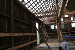 We added 2x8 oak bump rails to the interior face of the framing to protect the siding from damage from large hay bales.