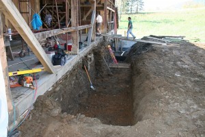 Barn bridge excavated to install drainage and concrete retaining wall to resist ground heave against the stonework.