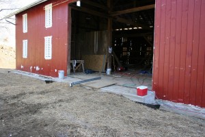 Retaining wall in place and backfilled.  Siding complete on barn bridge wall.
