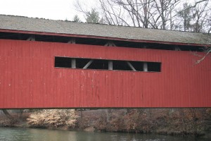 Before our start of work -- Peeling paint, deteriorated woodwork, and a failed roof.