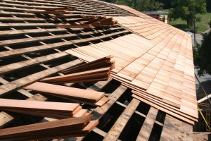 West side shingles in progress, showing triple coverage of highest-grade 24" clear cedar shingles.