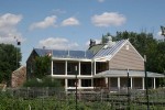 Wrap around porches, second story balcony and new galvanized, standing seam metal roof.